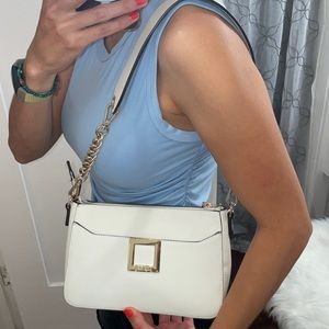 White bag with gold accents in leather